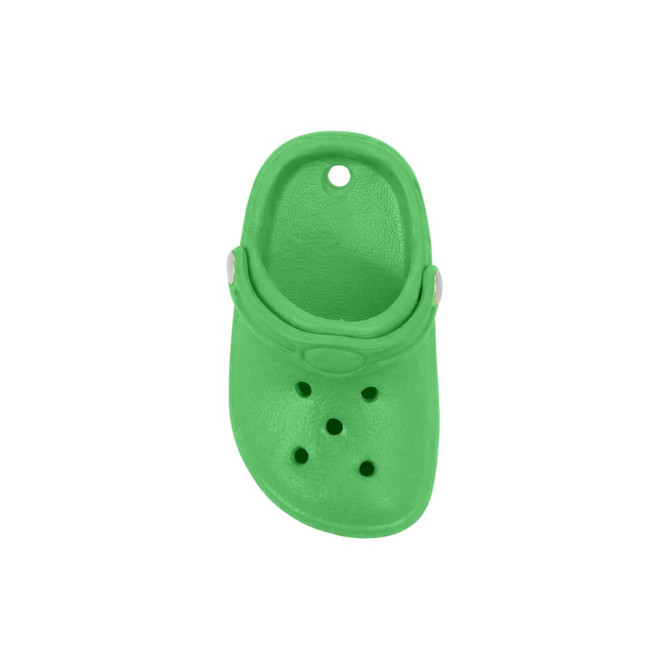 A small green clog shoe fridge magnet with decorative holes and a strap, featuring a circular hole at the top.