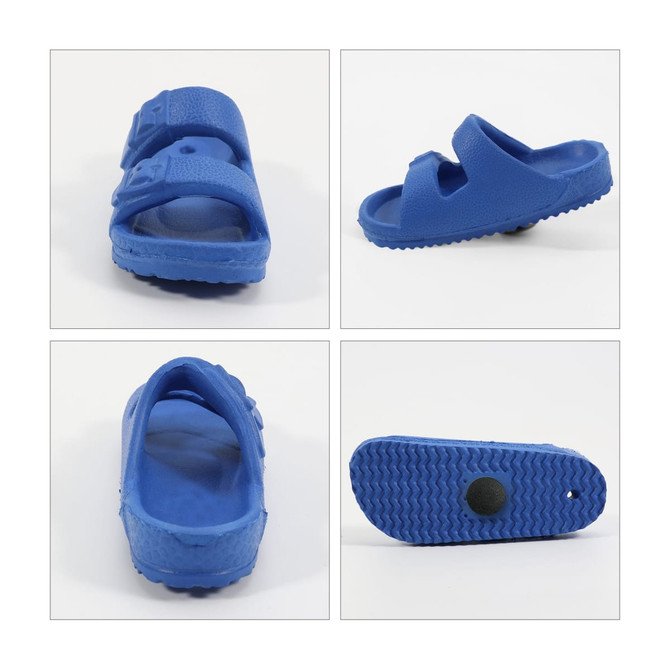 A blue clog shoe with an adjustable strap, featuring a textured sole and a logo on the side.