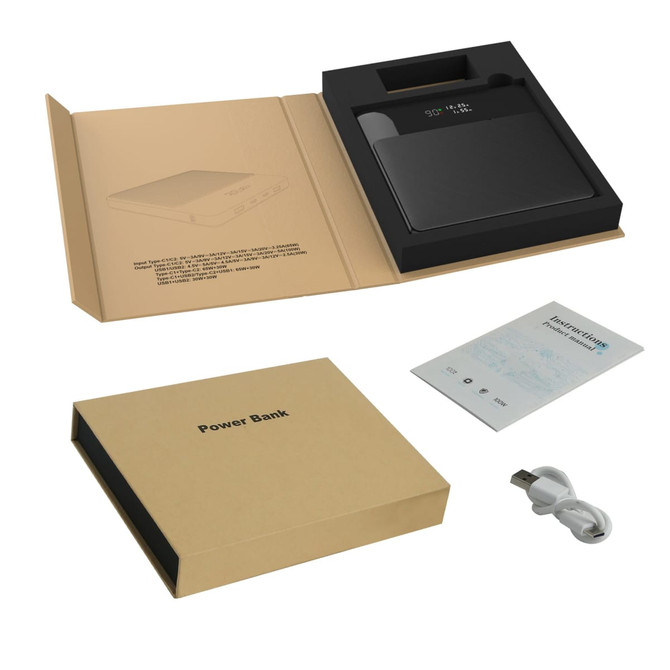 A black 20000mAh power bank with a packaging box, instruction manual, and USB cable on a light background.