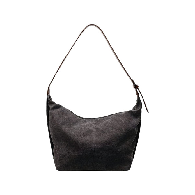 A dark grey canvas tote bag with a single brown leather strap and a minimalist design. Features a logo.