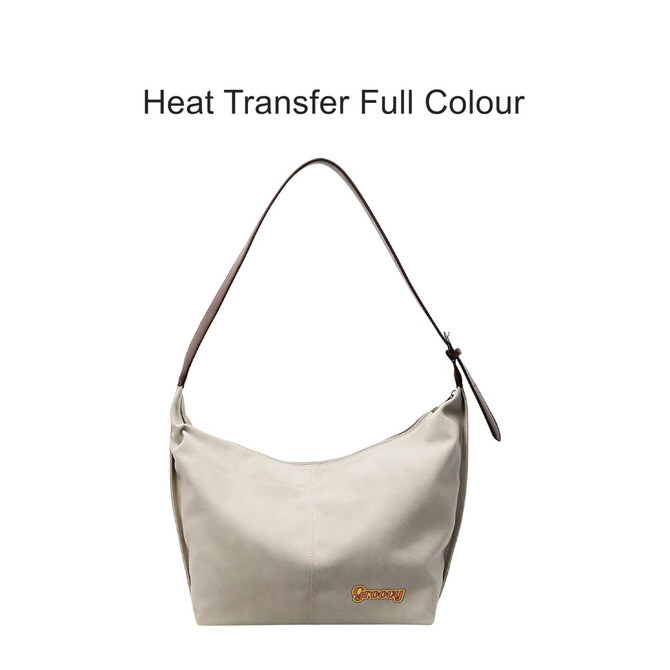 A light beige canvas tote bag with a brown strap and a logo, featuring a simple, stylish design.
