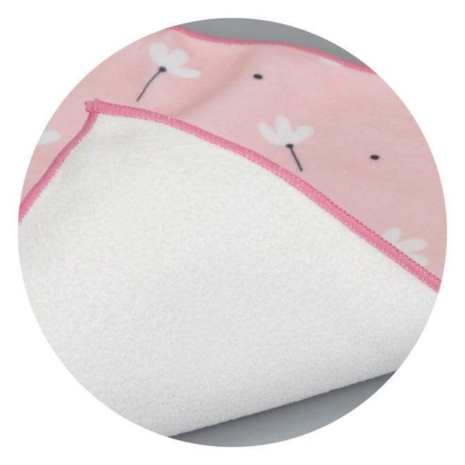 A medium blanket featuring a pink floral design on one side and a soft white underside. It has a contrasting pink trim.