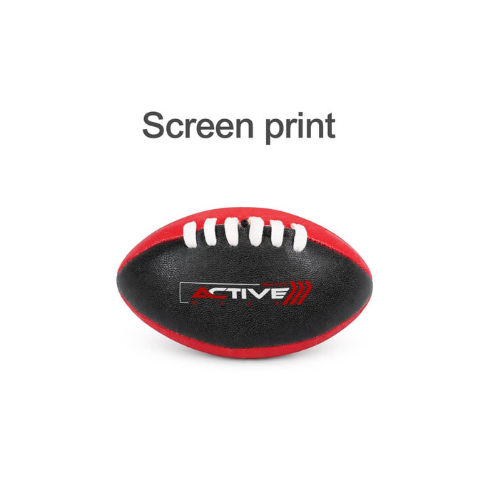 A mini Australian rules football in red and black, featuring white stitching and a logo.
