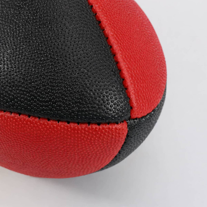 A Mini Aussie Rules ball in red and black, featuring a textured surface and seam detailing.