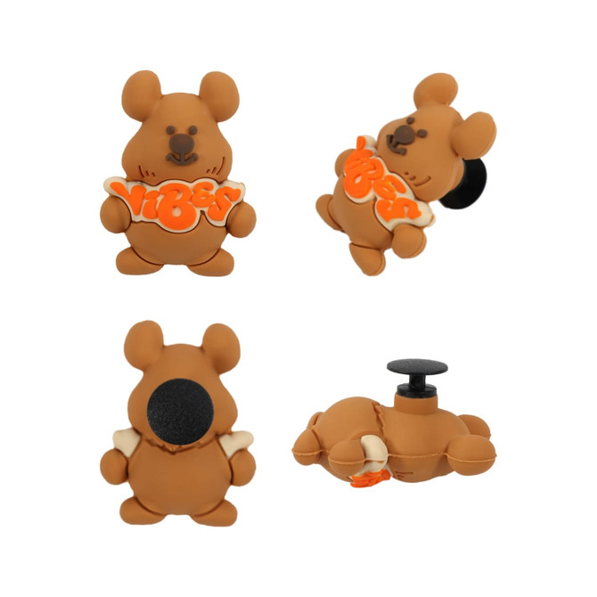 A set of four brown 3D charm shoe accessories featuring a bear design with the word "Vibes" in orange.