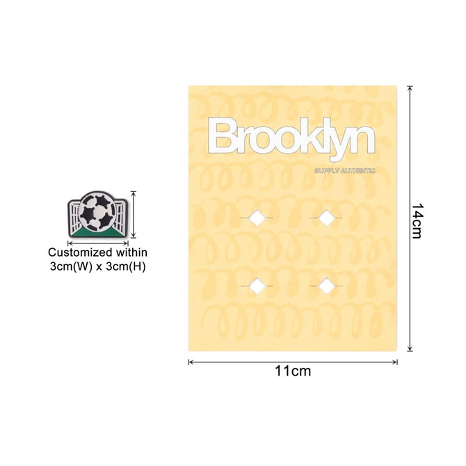 A pack of custom shoe charms featuring a soccer design on a yellow card, measuring 11cm by 14cm.