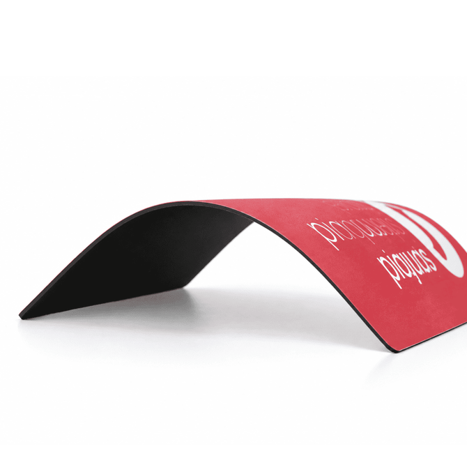 A red mouse mat with a natural rubber base. It features a slight curve and has a logo on the surface.