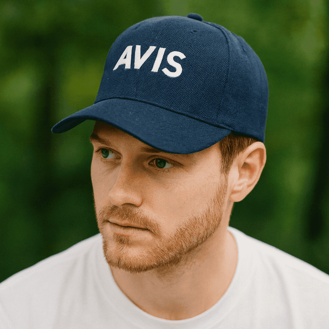 A navy blue baseball cap with a structured design and a logo on the front.