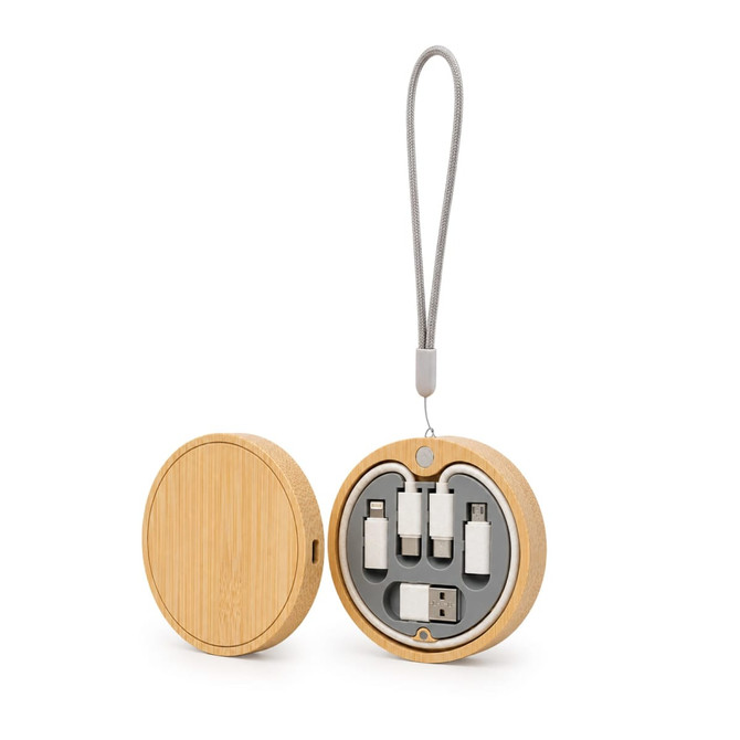 A round wooden wireless charger set in natural bamboo colour, containing various charging cables and a strap.