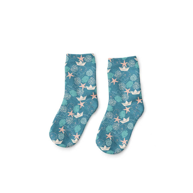 A pair of teal soccer socks featuring a pattern of stars and circles in pink and white, with a logo present.