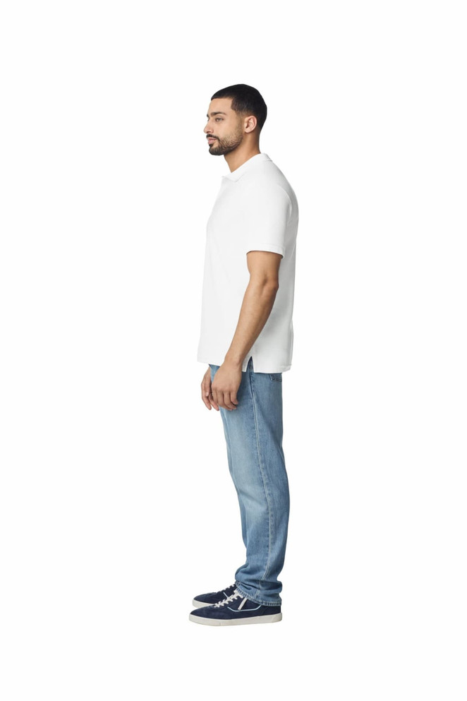 A white polo shirt displayed on a male model, paired with blue jeans and casual footwear. The shirt features a logo.