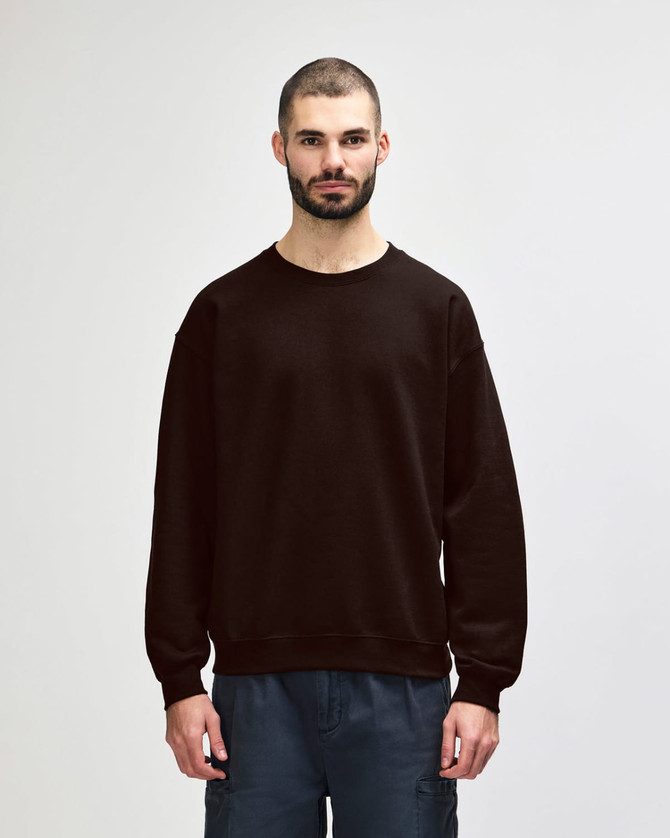 A brown Gildan Heavy Blend adult crewneck sweatshirt with long sleeves, worn by a model.