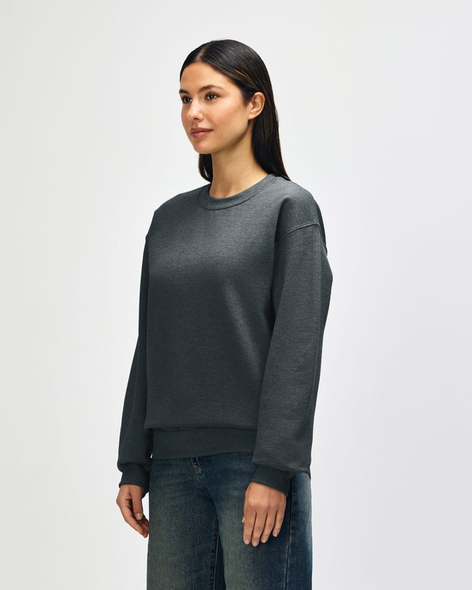 A grey Gildan Heavy Blend adult crewneck sweatshirt with a relaxed fit and long sleeves, featuring a logo.
