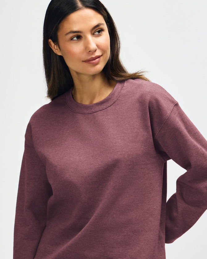 A maroon Gildan Heavy Blend adult crewneck sweatshirt displayed on a model with a neutral background.