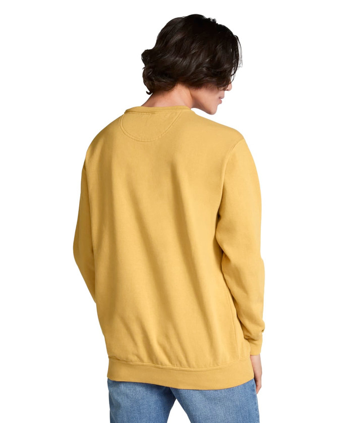 A yellow crewneck sweatshirt features a relaxed fit and a back view on a model, with a logo on the garment.