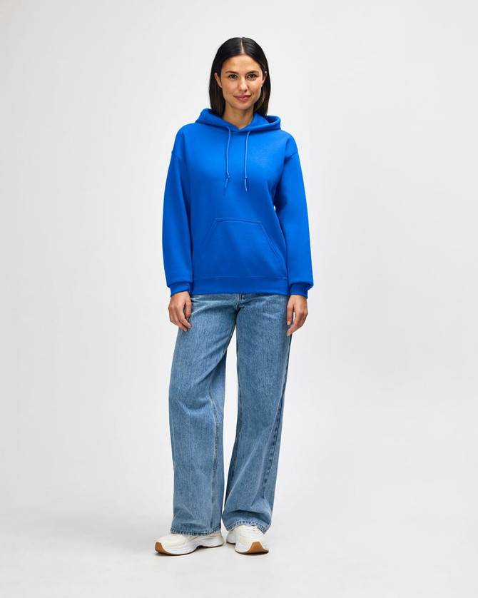 A blue hooded sweatshirt paired with jeans, featuring a front pocket and drawstring hood, modelled by a woman.
