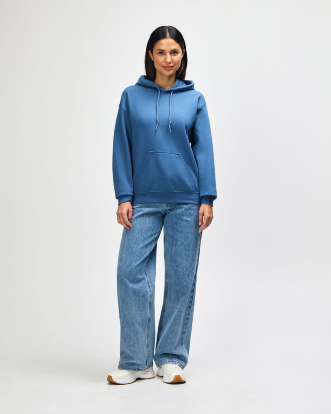 A blue hooded sweatshirt with a kangaroo pocket, paired with light blue jeans and white shoes.