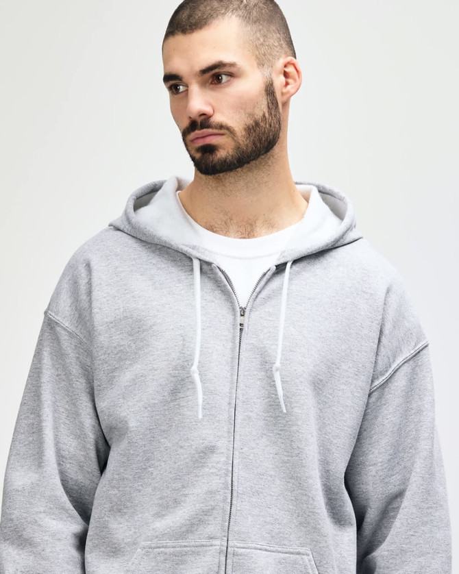 A grey adult full zip hooded sweatshirt with a front pocket and a hood, worn by a man.