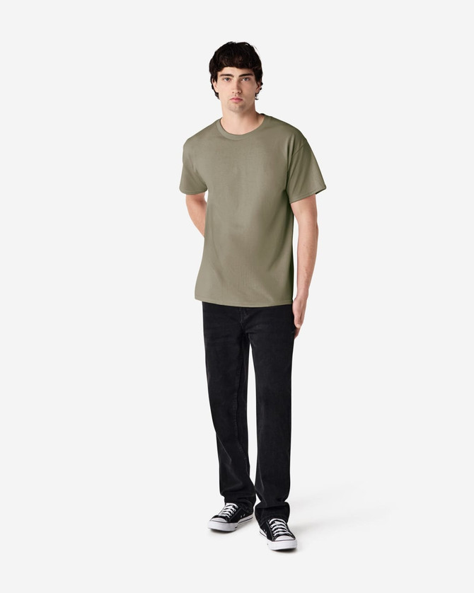 A model wearing an olive green Gildan Ultra Cotton T-Shirt paired with black pants. The shirt has a logo on it.