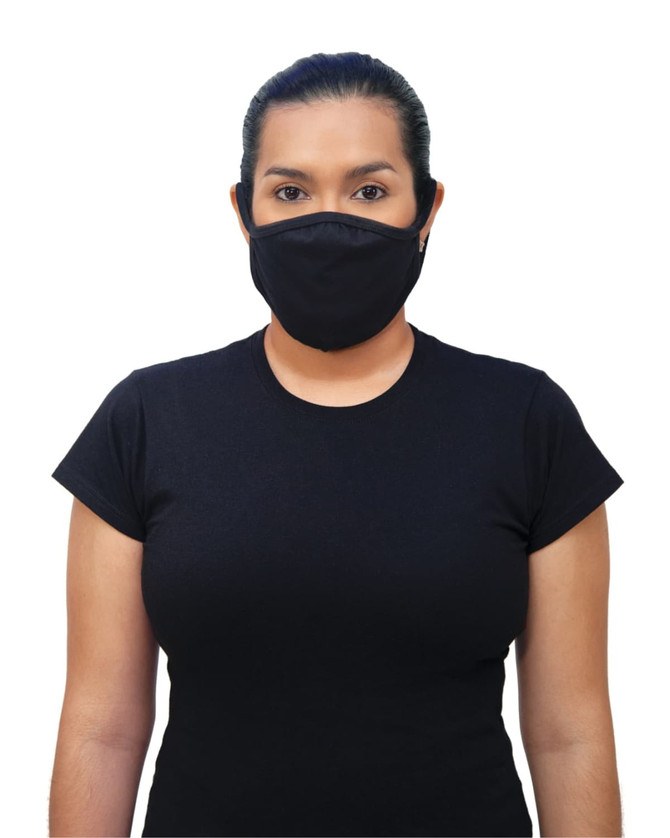 A woman wearing a black Gildan mask, featuring a logo, stands in a black t-shirt against a white background.
