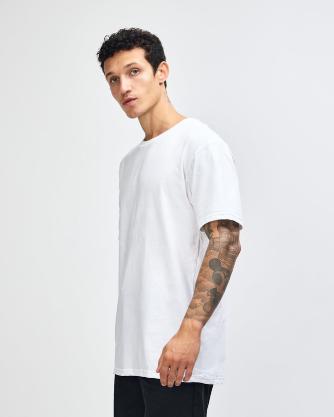 A white unisex fine jersey short sleeve t-shirt displayed on a model from the side. The shirt has a logo.