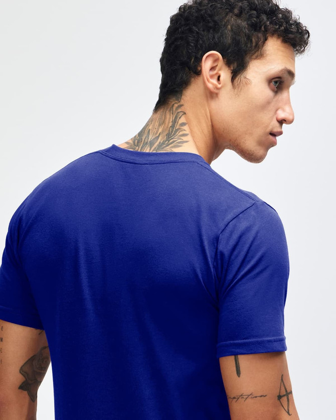 A blue short sleeve t-shirt with a fitted style, featuring a branding logo on the back.