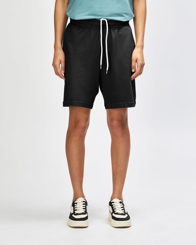 Unisex sports shorts in black, featuring an elastic waistband and a single back pocket. Includes branding.