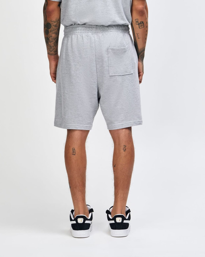 Grey unisex gym shorts with an elastic waistband and a back pocket, featuring a logo. 