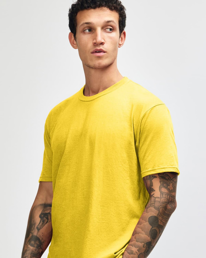 A unisex short sleeve T-shirt in bright yellow with a casual fit. The T-shirt features a logo on it.