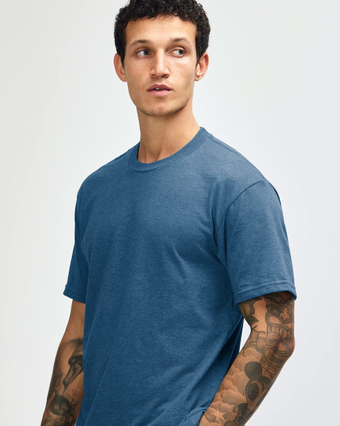 A unisex short sleeve t-shirt in a deep blue colour, featuring a simple design and a subtle logo.