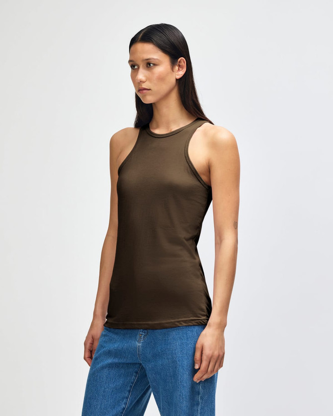 A fitted olive green women's racerneck tank top with a logo, styled with light denim shorts.