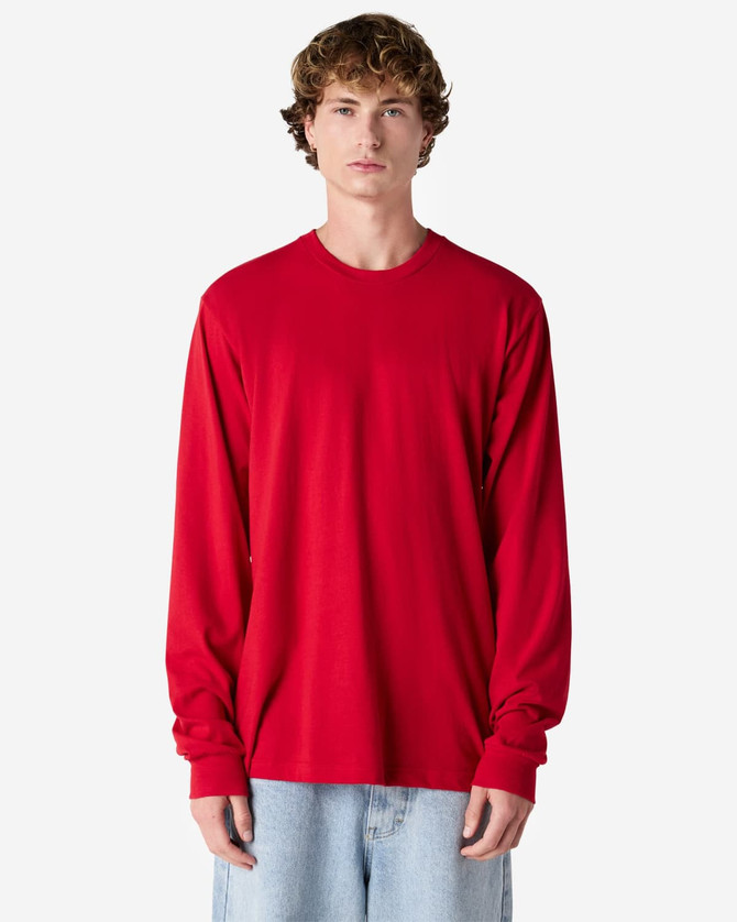 A red long sleeve T-shirt featuring a fitted design, displayed on a model in a neutral background.