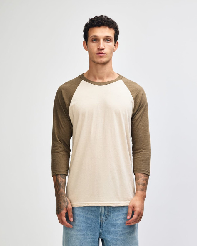 A unisex raglan T-shirt featuring a cream body with olive green sleeves, along with a logo on the front.