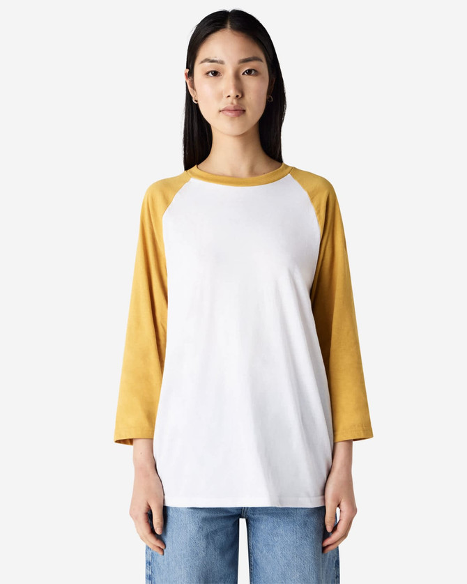 A unisex raglan T-shirt featuring a white body and mustard yellow sleeves. The shirt has a logo on it.