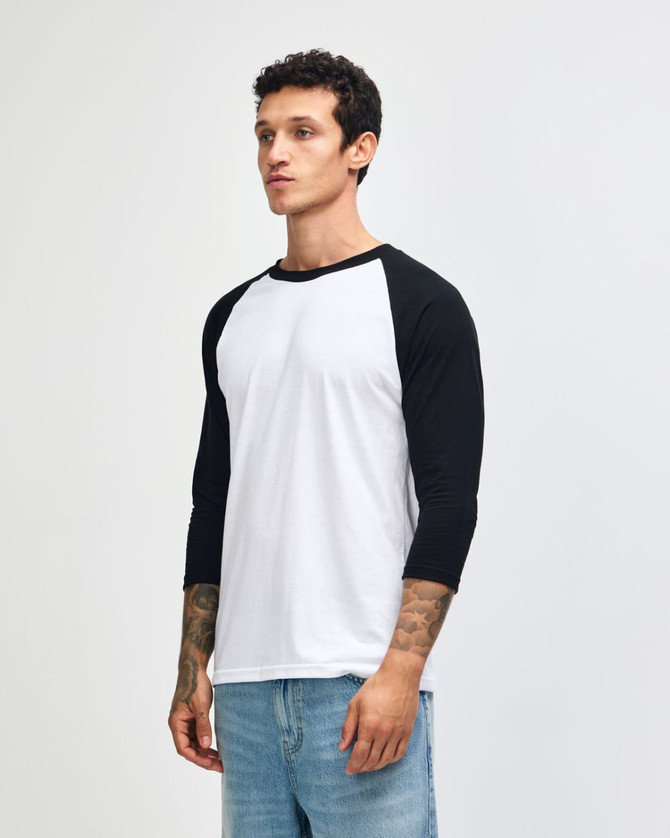 A black and white unisex raglan T-shirt with three-quarter sleeves. It features a logo on the sleeve.