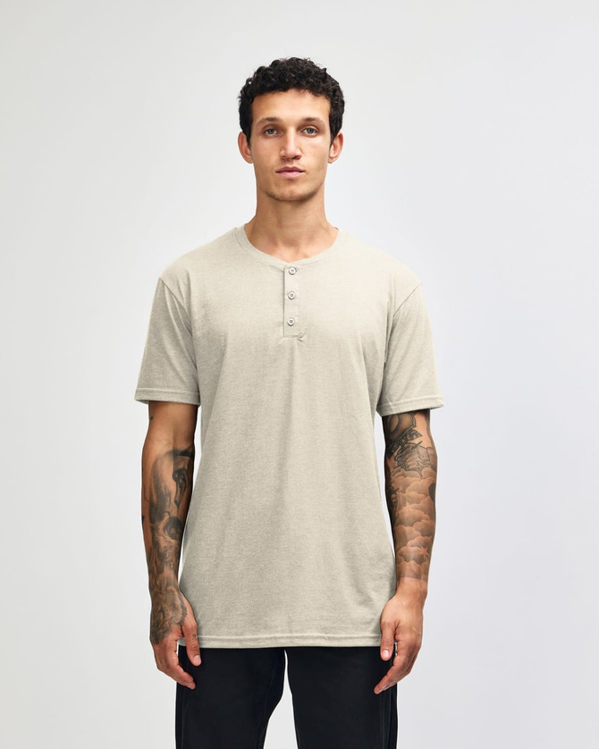 A beige unisex Henley T-shirt with short sleeves and a front placket, displayed on a male model.