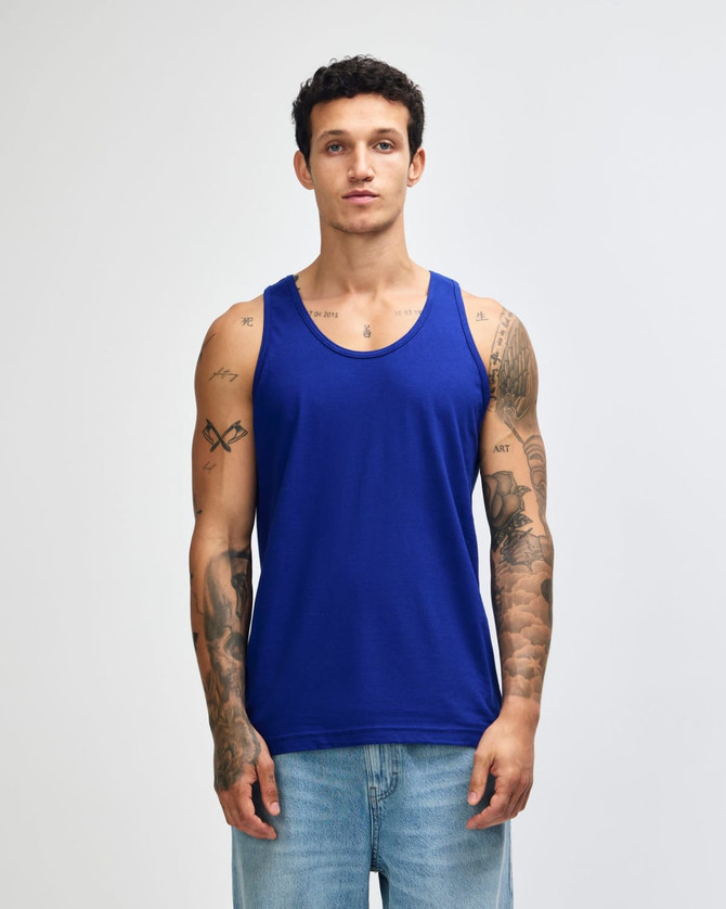 A blue unisex fine jersey tank top with a logo, displayed on a model against a plain background.
