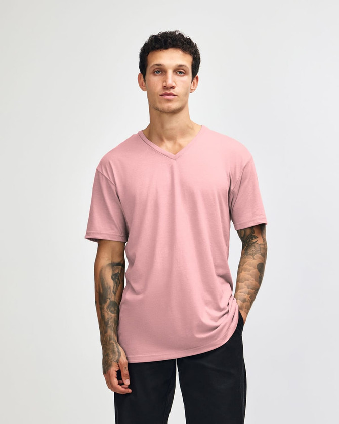 A unisex V-neck T-shirt in a soft pink colour, featuring short sleeves and a relaxed fit. It has a logo.