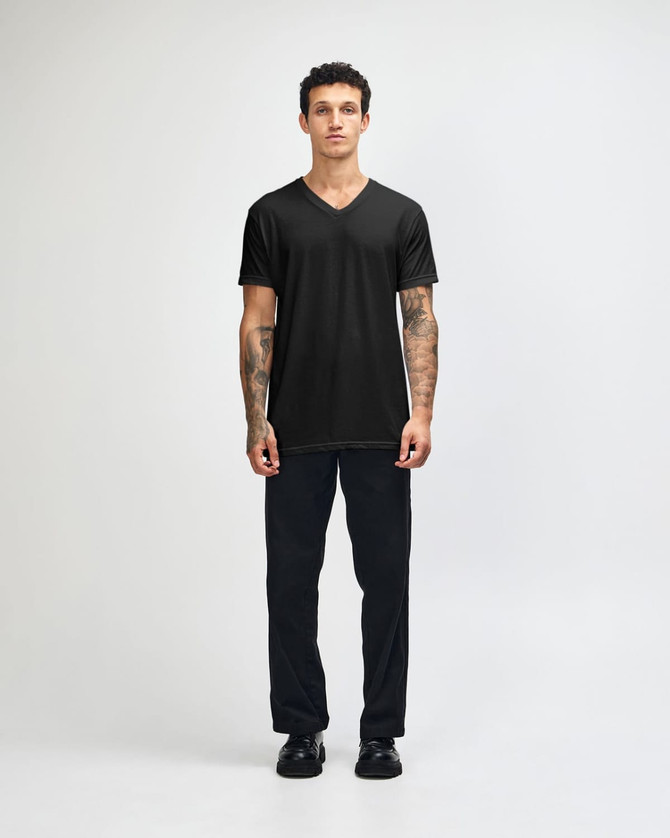 A black unisex V-neck T-shirt displayed on a model, featuring short sleeves and a fitted style.