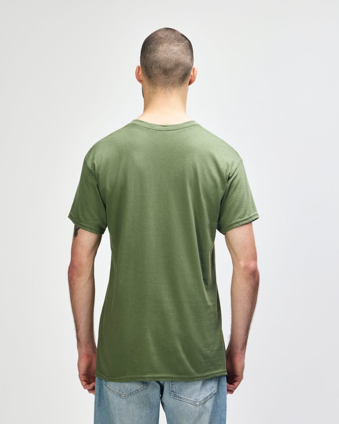 A man wearing a plain olive green Gildan Heavy Cotton Adult T-Shirt, viewed from the back. The shirt has a logo.