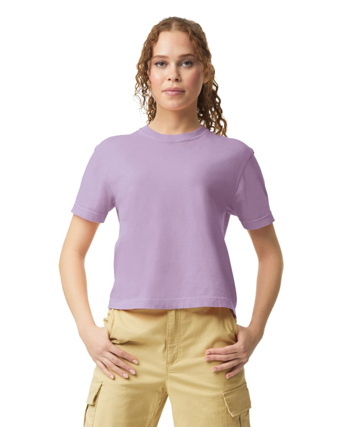A lavender women's heavyweight boxy T-shirt with short sleeves, displayed by a model in casual attire.