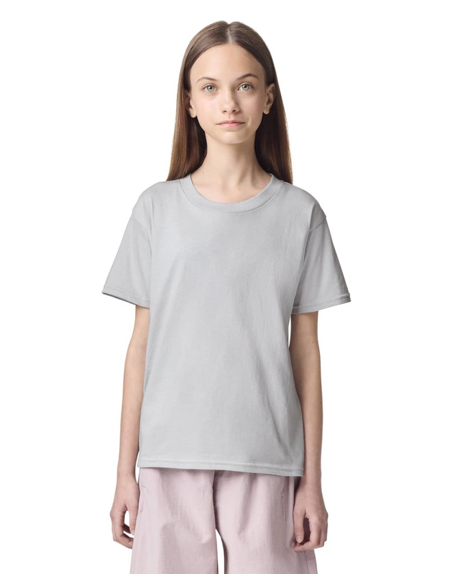 A light grey fine jersey youth t-shirt displayed on a model. The shirt has a simple design and a logo.