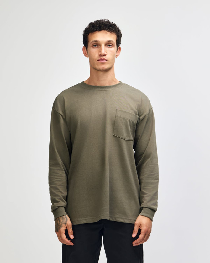 A long-sleeved, olive green heavyweight T-shirt featuring a pocket and a logo.