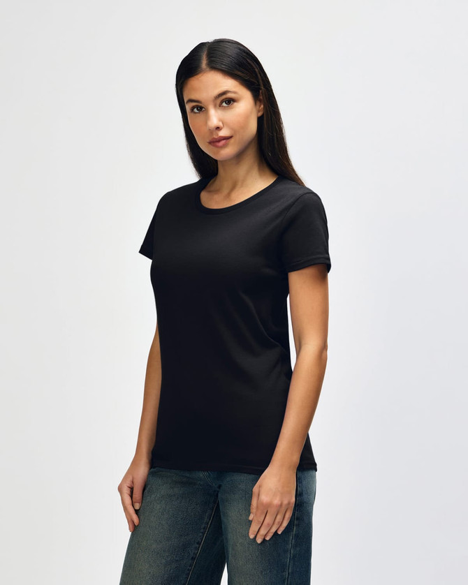 A black Gildan Heavy Cotton ladies' T-shirt displayed on a model. The product features a classic crew neck design.