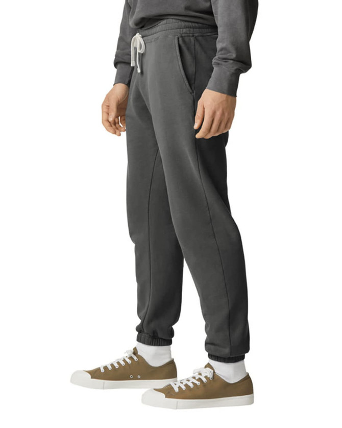 Lightweight grey sweatpants with a relaxed fit and side pockets, featuring a drawstring waist and a logo.