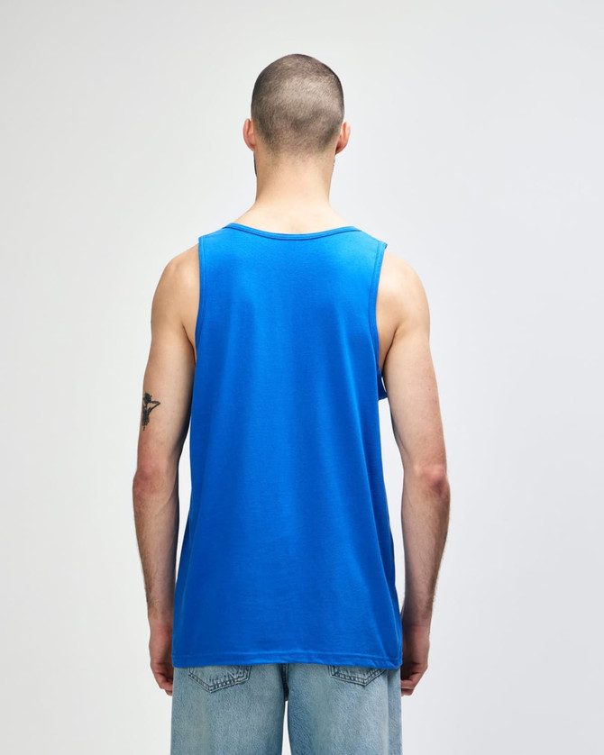 A blue Gildan Heavy Cotton adult tank top, viewed from the back. It features a plain design and has a logo.