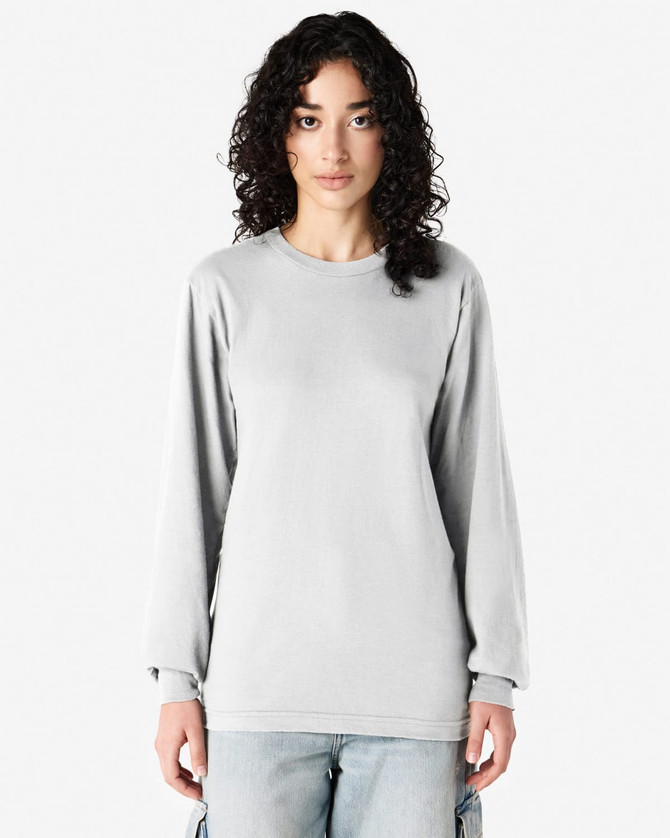 A grey long sleeve T-shirt featured on a model, made from fine jersey fabric, with a simple design and no visible logos.