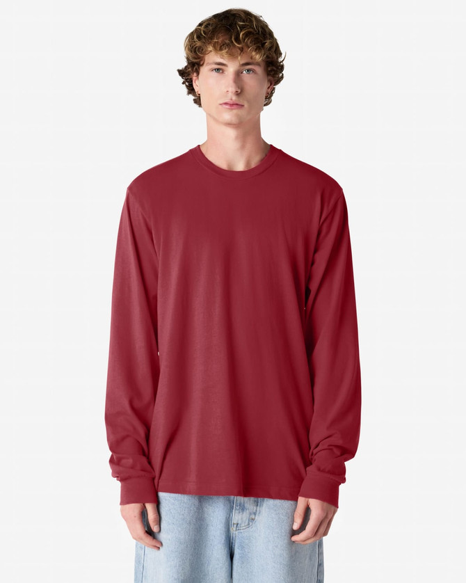 A red long sleeve T-shirt with a relaxed fit and a simple design, featuring a brand logo.