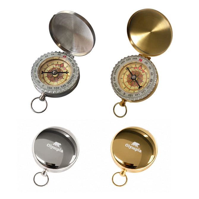 A collection of four compasses in various finishes: silver, gold, black, and brushed metal, each with a decorative dial.
