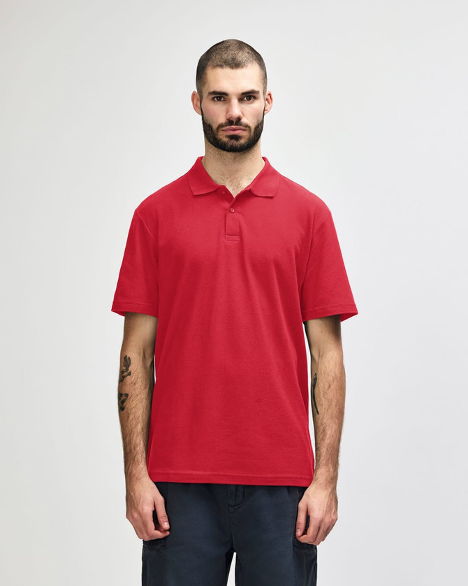 A red adult double pique polo featuring a collar and short sleeves; includes a logo on the chest.
